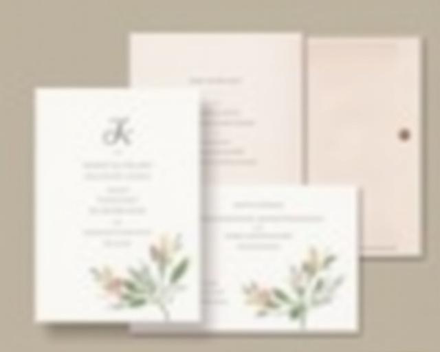 A set of elegant stationery with a custom monogram and floral design.